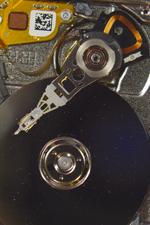 Thumbnail for File:Seagate Microdrive Actuator, Arm, Read Write Head and Platter (8572334395).png