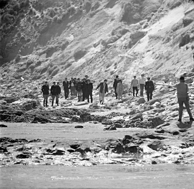 A search party combing Cheviot Beach after Holt's disappearance