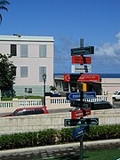 Signs pointing to various world destinations from San Juan, Puerto Rico.jpg