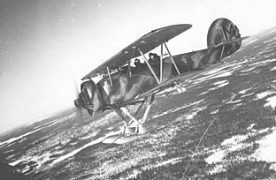 A Hawker Hart, in the Swedish B4-variant, flying over a winter landscape in Finland.