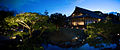 Traditional japanese pavilion exterior placed in a garden surounded with a pond. Kyoto