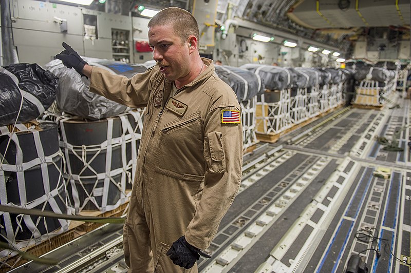 File:U.S. Air Force Tech. Sgt. Russell Johnson, a C-17 Globemaster III aircraft loadmaster with the 816th Expeditionary Airlift Squadron, guides a K-loader operator while loading container delivery systems inside his 130110-F-PM120-158.jpg