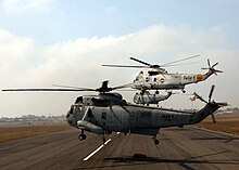 Several UH-3H Sea Kings taking flight to fight the Cedar Fire in San Diego, California, in 2003 US Navy 031029-N-5067K-031 Several UH-3H Sea King helicopters depart Montgomery Field.jpg