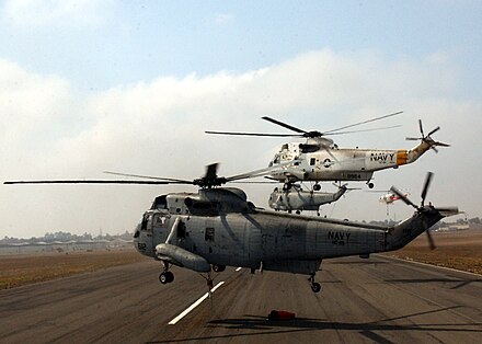 Several UH-3H Sea Kings taking flight to fight the Cedar Fire in San Diego, California, in 2003