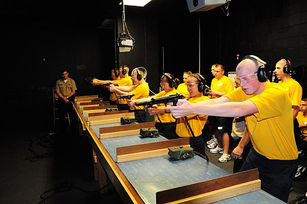 Navy Junior ROTC cadets from Hamilton High School, Ohio, practice marksmanship at the Fire Arms Training Simulator (FATS)