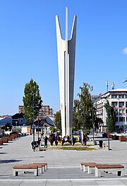 The Monument of Brotherhood and Unity by Miodrag Zivkovic in the city center. "Brotherhood and unity" was a popular slogan of the Communist Party of Yugoslavia. Unity-Brotherhood Monument Prishtina7.jpg