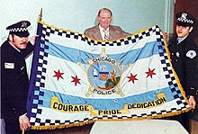 CPD policemen unveiling the flag of the Chicago PD in 1977 Unveiling of the flag of the Chicago Police Department, c. 1977.jpg