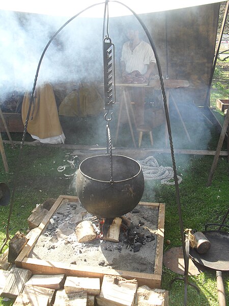 Replica of a Viking cooking-pot hanging over a fire