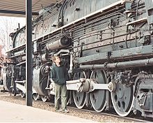 A tourist views one of the 2-8-8-4 locomotives that hauled iron ore to Two Harbors. This engine is preserved in Two Harbors next to the Lake County Historical Society building (the old train depot). 2-8-8-4 Yellowstone.jpg