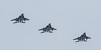 A formation of three F-15C/D Eagles overhead Kadena Air Base in Okinawa, Japan. The aircraft are assigned to the 18th Wing.