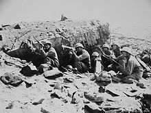 Riflemen from 3rd Battalion, 23rd Marines fire on the enemy from a destroyed Japanese pillbox. Iwo Jima - February 1945 3 23 Iwo Jima.jpg