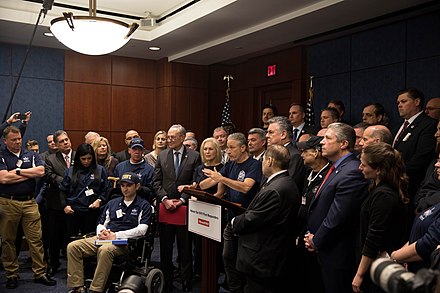 Stewart speaking at a press conference for the 9/11 first responders in 2019