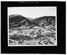 AERIAL PHOTOGRAPH TAKEN IN 1950, LOOKING TO THE SOUTH. THE 1916 STABLES ARE LOCATED IN THE MIDDLE RIGHT PORTION OF THE PHOTOGRAPH (FORT HUACHUCA HISTORICAL MUSEUM, PHOTOGRAPH 1950.15.00 HABS AZ-210-18.tif