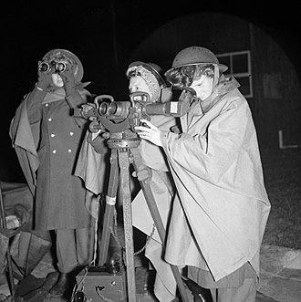 ATS members operating an AA identification telescope at a 3.7-inch gun site firing against V-1 flying bombs, 21 July 1944. ATS girls operate a rangefinder at a 3.7-inch anti-aircraft gun site firing against V-1 flying bombs, 21 July 1944. H39680.jpg