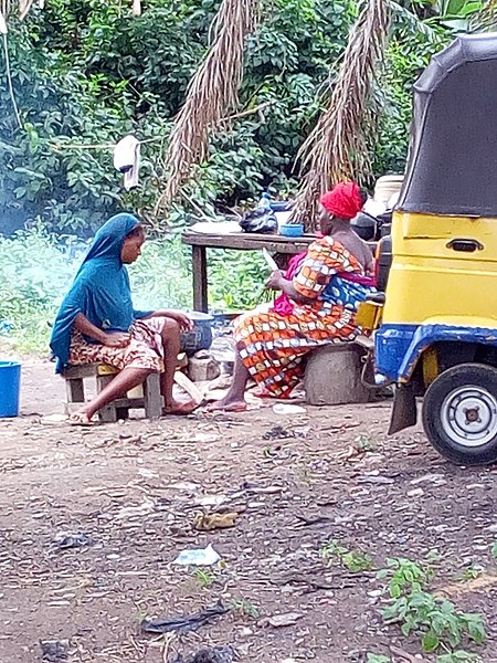 File:African women cooking food for sale.jpg