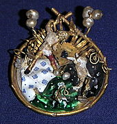 Burgundian ronde-bosse enamel brooch in the Essen treasury. The Essen treasure contains sixteen of these rare pieces of jewelry from the 14th century. Agraffe Essener Domschatz.JPG