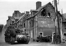 M7 Priest of the 14th Armored Field Artillery Battalion in Normandy American tank in Carentan.jpg