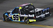 Ben Rhodes in the No. 99 at Daytona International Speedway in 2019 Ben Rhodes 99 Truck 2020 (46248424235) (cropped).jpg