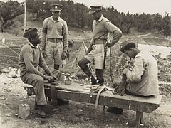 Bermuda Militia Infantry soldiers in camp, two with field service caps, circa 1940