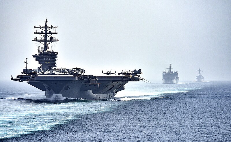 File:CVN 69 transits the Strait of Hormuz (28465403076).jpg