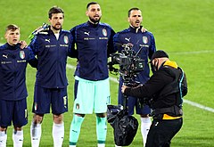 A football camera operator shoots the Italy national team before a match (2021)