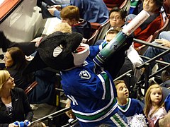 Fin the Whale firing a T-shirt cannon at a Vancouver Canucks game in 2009.