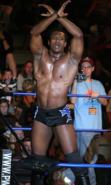 Coleman posing on the ring turnbuckles in January 2012. Caprice Coleman poses on the turnbuckles.jpg