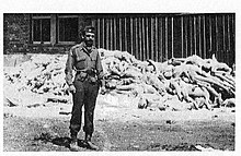 Capt.Alfred de Grazia at Dachau concentration camp, ca May 1st 1945.jpg