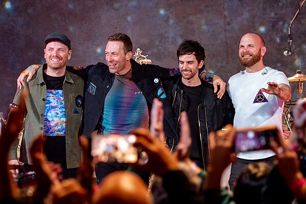Coldplay at Broadcasting House in 2021. From left to right: Buckland, Martin, Berryman and Champion.