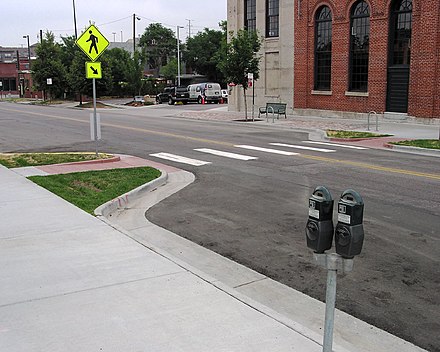 A curb extension at a mid-block crosswalk