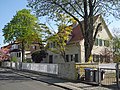 Single-family house with garage extension, fencing and garden