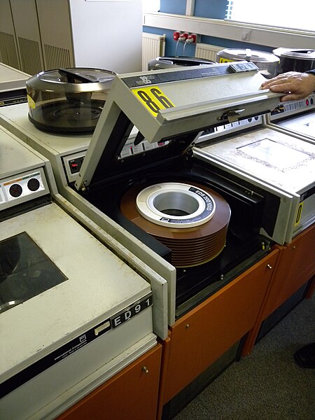 File:Disk drive of professional large computer system (1970s) with removable disk pack as storage medium inside, from 'International Computers Limited'.jpg