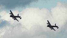 In 2014, FM213 crossed the Atlantic to tour with the Battle of Britain Memorial Flight, which operates the only other airworthy Lancaster, PA474 seen here with VeRA. DunsfoldLancasters3883.JPG