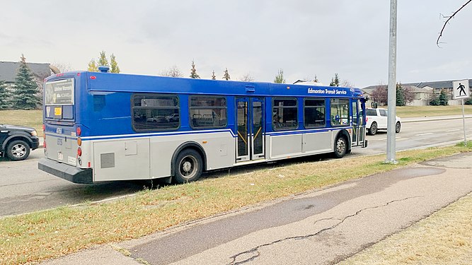 Side view of Edmonton Transit Service New Flyer D40LFR on route 560 service to Spruce Grove