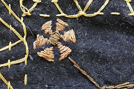 Embroidered flower on a wall hanging from Bangladesh