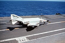 VF-33 - Vietnam (1968) F-4J Phantom II of VF-33 lands aboard USS America (CVA-66), in 1968 (6432035).jpg