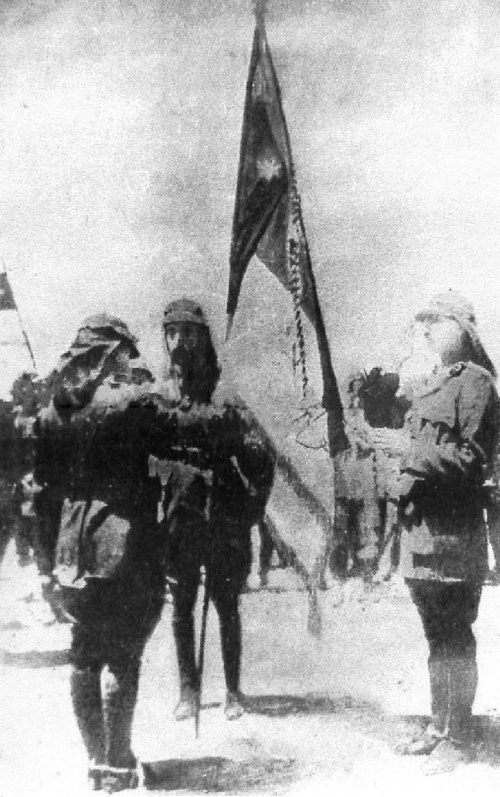 King Faisal (center) and War Minister Yusuf al-Azma (left, in front of Faisal), 1920