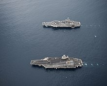 George H.W. Bush (top) conducts an ordnance transfer with Harry S Truman off the East Coast in 2011 Flickr - Official U.S. Navy Imagery - CVN 75 and CVN 77 conduct ordnance transfer..jpg