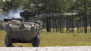 M1134 anti-tank guided missile vehicle fires a BGM-71 TOW missile.