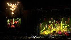 Doro on stage with Grave Digger and Van Canto at Wacken Open Air 2010; she is a veteran of the festival, where she played with her band or as guest for eight times.