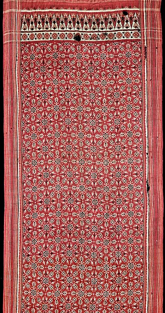 Patan patolu, 1725-1800. This fine heirloom was likely woven for export to Sumatra, where the Gujarati patolas strongly influenced local ikat designs. Gujarat patola 1725-1800.jpeg