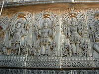 An art depiction of the Trimurti at the Hoysaleswara temple in Halebidu