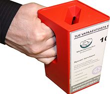 Door to door fundraising frequently involves a hand-held collection box Hand holding a red fundraising box.jpg