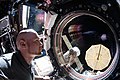 ISS-57 Alexander Gerst peers out the Cupola module.jpg