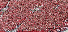 University of Wisconsin students in sections O & P at Camp Randall Stadium jumping around and dancing in 2014 to "Jump Around" Jump Around Wisconsin Badgers Sept 6 2014.jpg