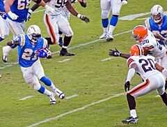 Tomlinson against the Cleveland Browns in 2006. He scored 3 of his NFL single-season record 31 touchdowns in the game. LaDainian Tomlinson vs Cleveland (cropped).jpg