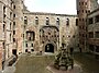 Linlithgow Palace rebuilt for James V to suggest an open-air Renaissance courtyard