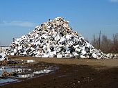 New Orleans, Louisiana, United States after Hurricane Katrina: mounds of trashed appliances with a few smashed automobiles mixed in, waiting to be scrapped Low9AppliancePiles2 (1).jpg