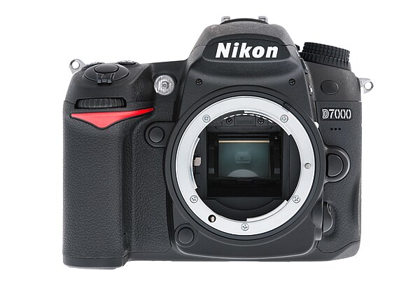 The Nikon D7000 reveals a modern F-mount design, including aperture lever (left), CPU contacts (top), and mechanical AF linkage (lower left).