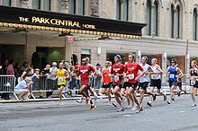 1:30 pace group on 7th Avenue passing Park Central Hotel, 2008 Nychalfmarathon.jpg